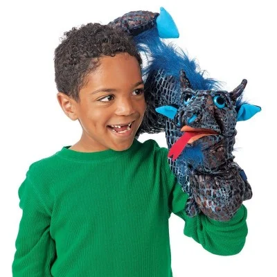 Child playing with a Folkmanis Sea Serpent hand puppet