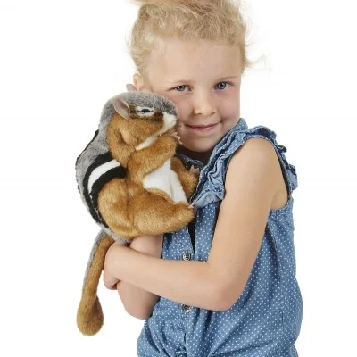 A young girl playing with a Tamia (chipmunk) hand puppet by Folkmanis