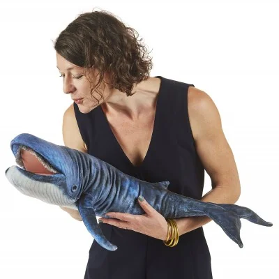 Woman operating a Folkmanis Blue Whale hand puppet Woman operating a Folkmanis Blue Whale hand puppet