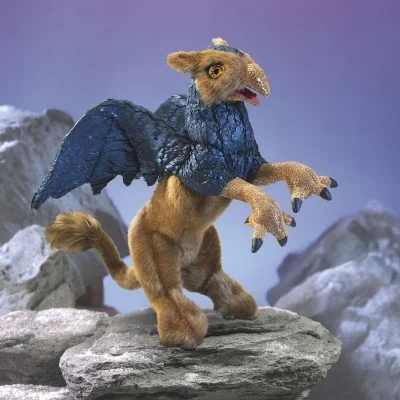 Folkmanis griffin hand puppet set against a mountain backdrop