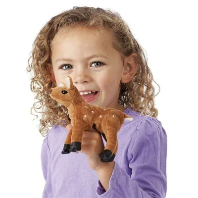 A young girl playing with a Folkmanis mini fawn finger puppet