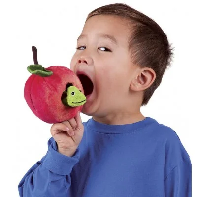 A child biting into the "Worm in the Apple" hand puppet