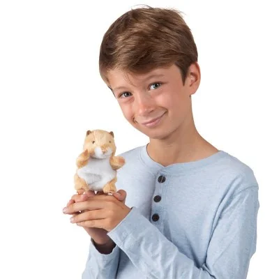 Young man holding a Folkmanis mini hamster puppet