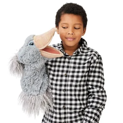 Boy playing with a Folkmanis "Hornbill" hand puppet