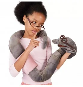 Girl playing with a "Bookworm" puppet by Folkmanis