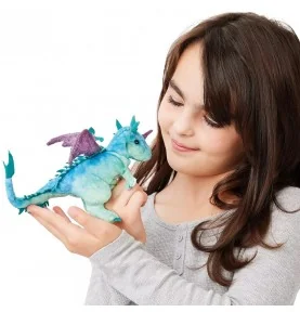 A young girl playing with a Folkmanis Mini Dragon puppet