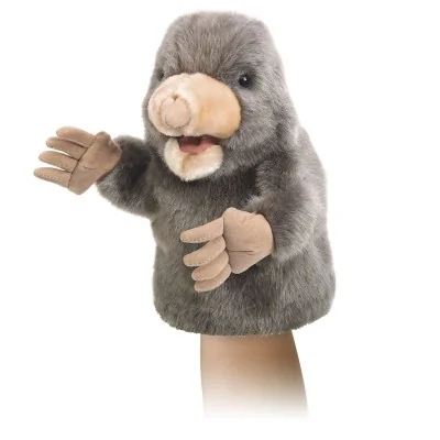 A person playing with a Little Mole hand puppet